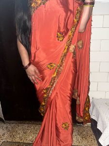 Elegant Orange Saree with Embellished Border