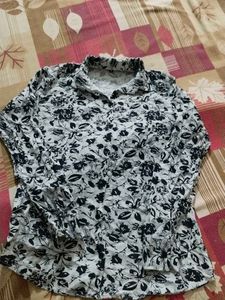 It Is A Shirt With Navy Blue Flowers