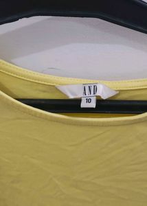 AND Yellow Back Tie Peplum Top