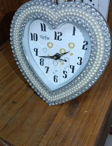 Beautiful heart shaped wall clock or table cloc