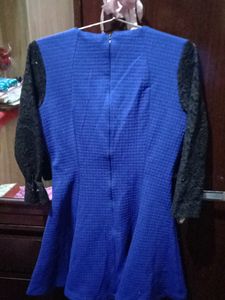 woolen top with net sleeves and back zip i used only once because it has deep neck from front and becoz of size issue
