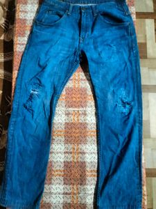 Distressed Blue Denim Jeans