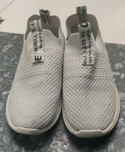 Worn White Casual Shoes