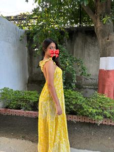 backless yellow flowy sundress