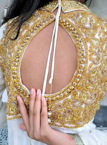 Stunning white gown with gold accents ✨