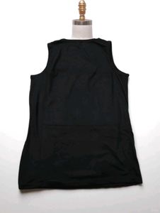 This black sleeveless t-shirt features a bold whit