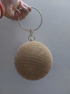 Round Studded Handheld Clutch With Metal Sling