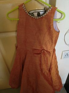 Girl&#39;s Orange Dress with Embellishments