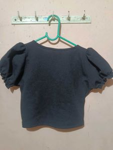 A Ruffled Black Crop Top