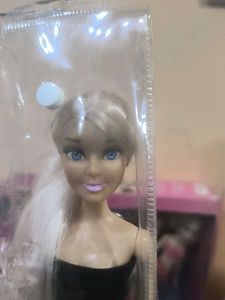 Hannah doll in black dress with long hair.