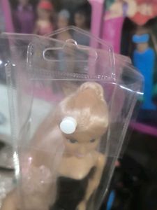 Hannah doll in black dress with long hair.