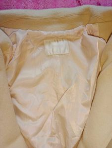 beige colour overcoat