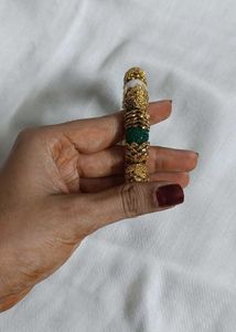 Gold-tone Bangle.