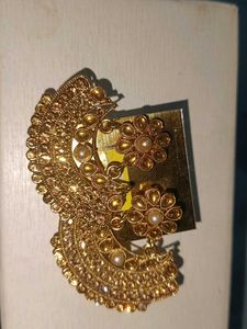 Gold tone earrings with pearl