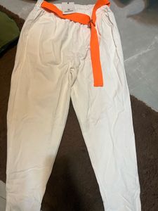 White High-Waisted Cotton Pants with Orange Belt