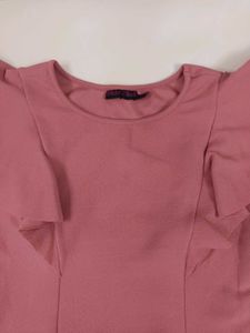 a cute top with ruffle sleeves.