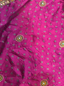 Megenta rajasthani tie-dye saree with bow blouse