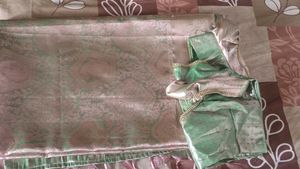 A Beautiful Light Green With Pink Shade Silk Saree