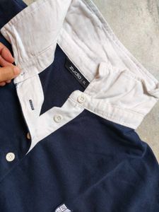 Navy Polo Shirt with White Collar
