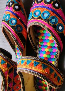 Jaipuri juttis or Rajasthani mojaris.