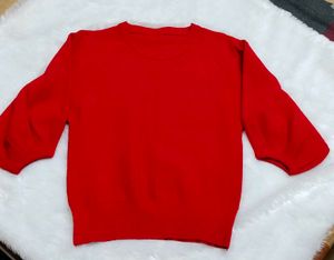 red woolen top