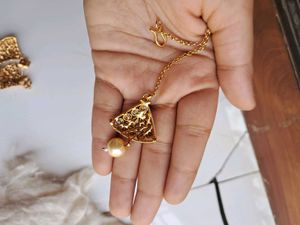 Gold-toned choker with earrings and headpiece