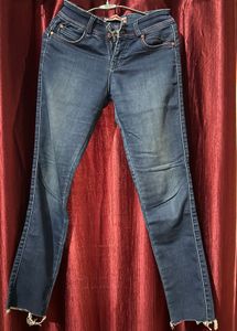 Blue jeans with beautiful red threadwork