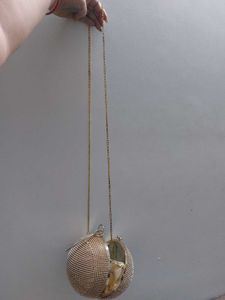 Round Studded Handheld Clutch With Metal Sling