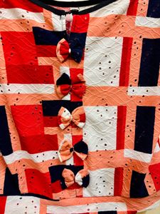 A simple top with cut-out and multicolour design.