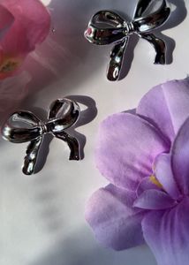 silver bow earring