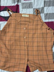 sleeveless checkered button-down top