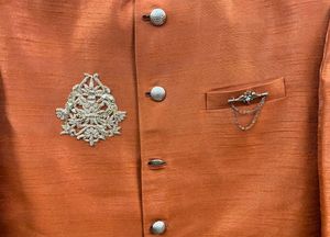 Free Jootis with Elegant Orange Sherwani