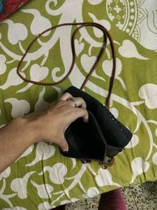 BROWN TASSLED SLING BAG