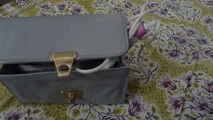 SLING BAG WITH HAIR ACCESSARIES
