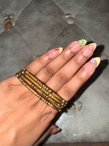 Set Of 4 Gold Tone Bangle