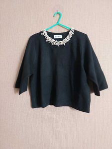 Elegant Black Top with Pearl Detail