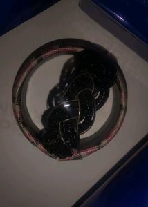 black breslet and a multi colour bangle