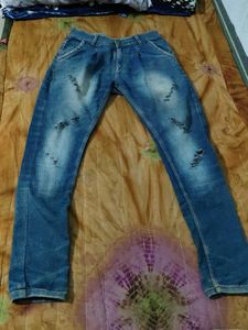 Ripped Blue Denim Jeans