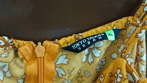 Orange Jumpsuit With Attached Belt