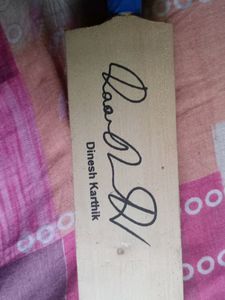 Cricket Bat With A Signature Of Dinesh Karthik