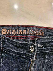 Stylish Jeans with Red Stripe