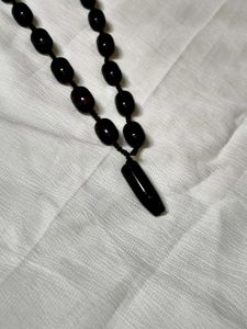 Black Bead Necklace with Lion Nail Pendant