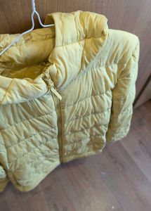 Uniqlo ultra light down jacket in butter yellow