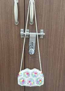A Sling Bag With Pearls