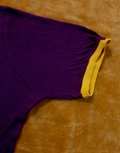 Maroon solid knitted regular top,