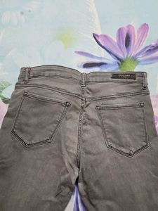 Gray Denim Jeans with Pom-Pom Detail
