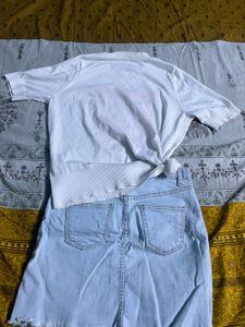 white printed top with blue mini denim skirt