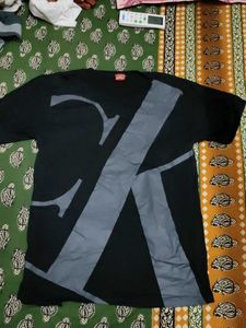 A BLACK T-SHIRT