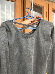 Combo of olive jacket and grey strip back top