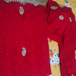 Shiffon bright red partywear saree, golden stone